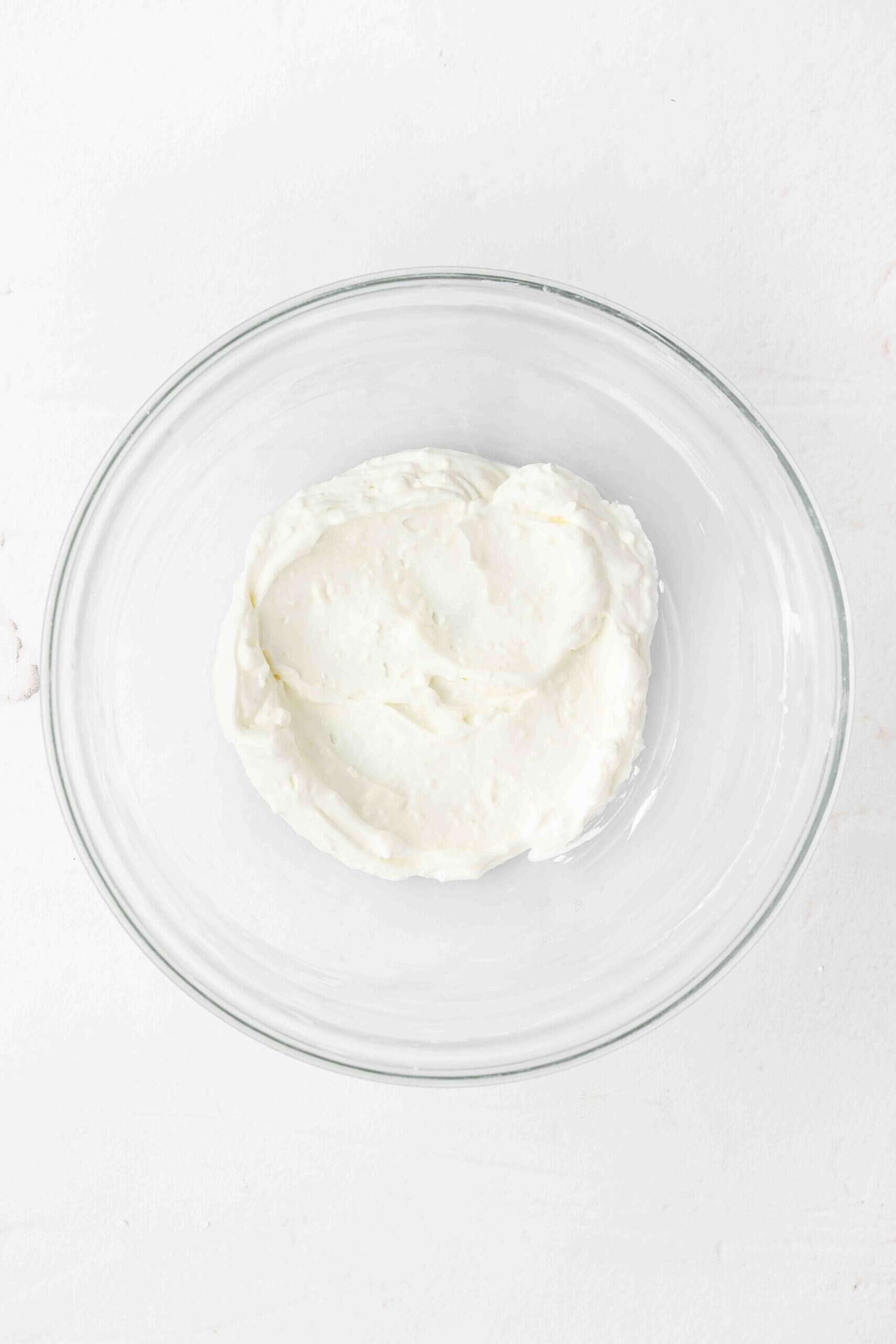 cream cheese and yogurt mixture in a glass bowl