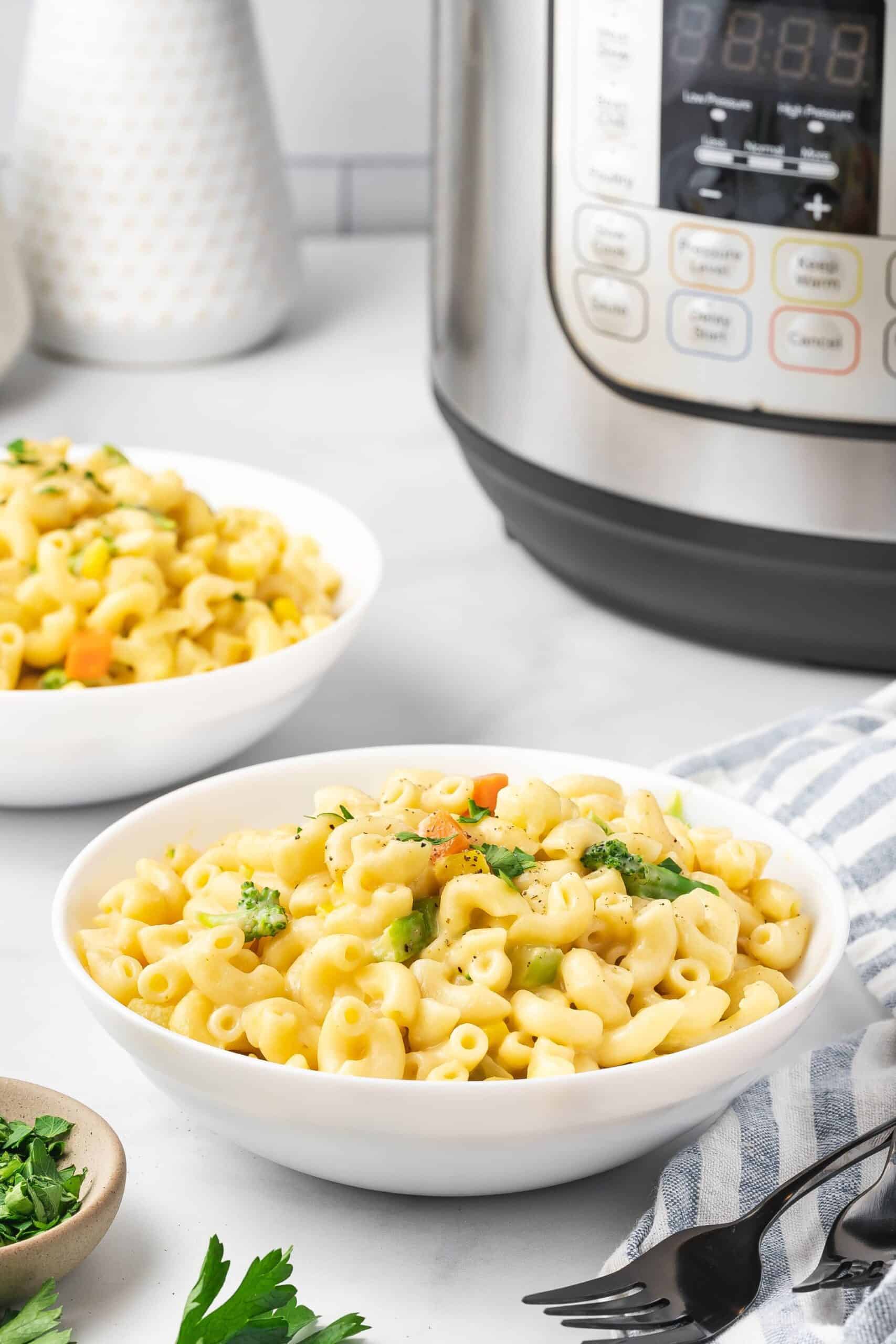 Simple bowl of creamy mac and cheese with vegetables