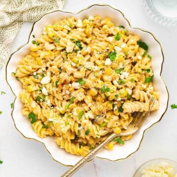 A large serving bowl filled with Mexican street corn pasta salad, perfect for sharing.