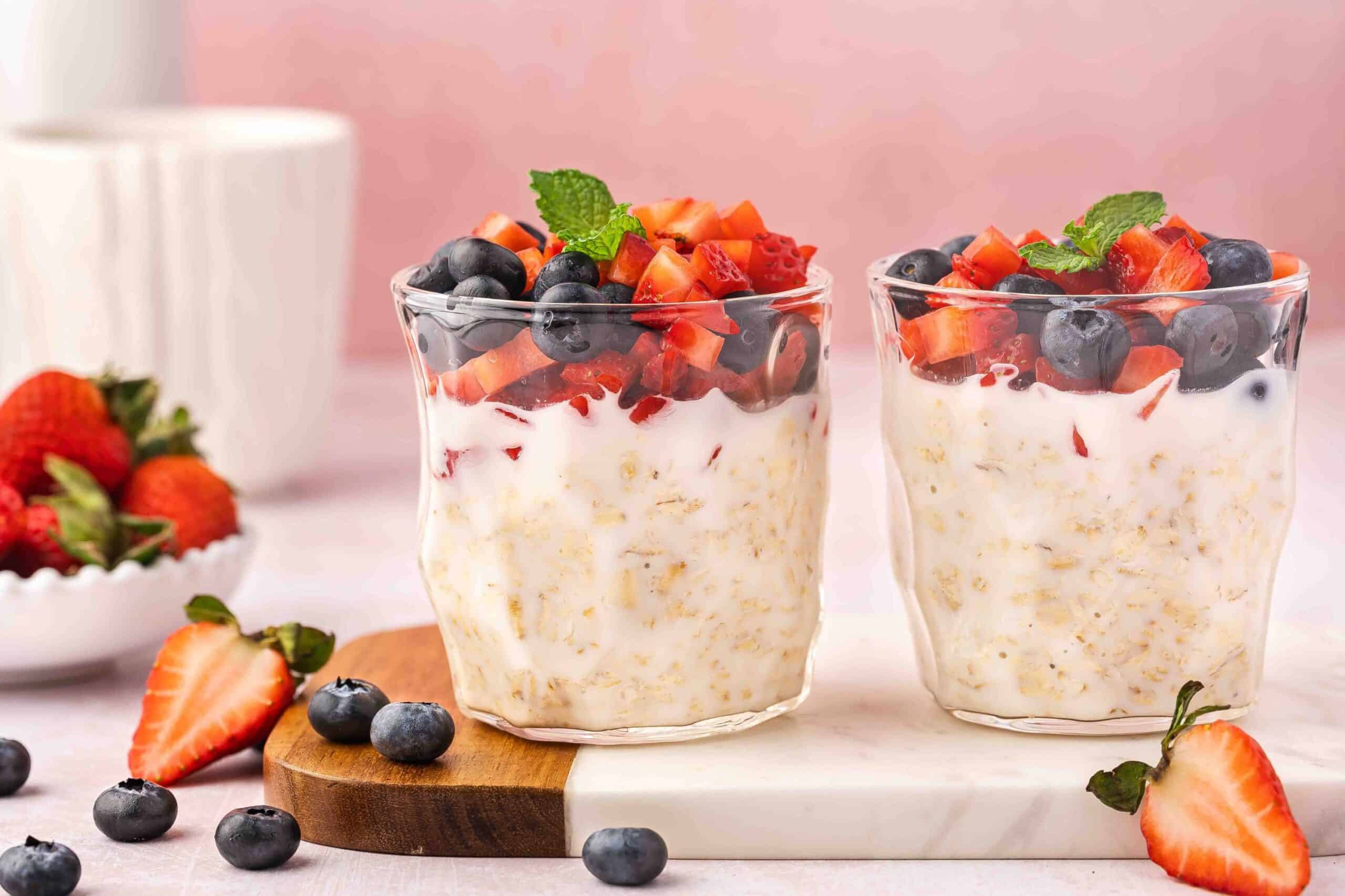 Healthy breakfast meal prep: blueberry and strawberry overnight oats ready to grab and go.