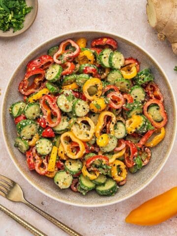 Bowl of cucumber mini pepper salad with sesame soy dressing