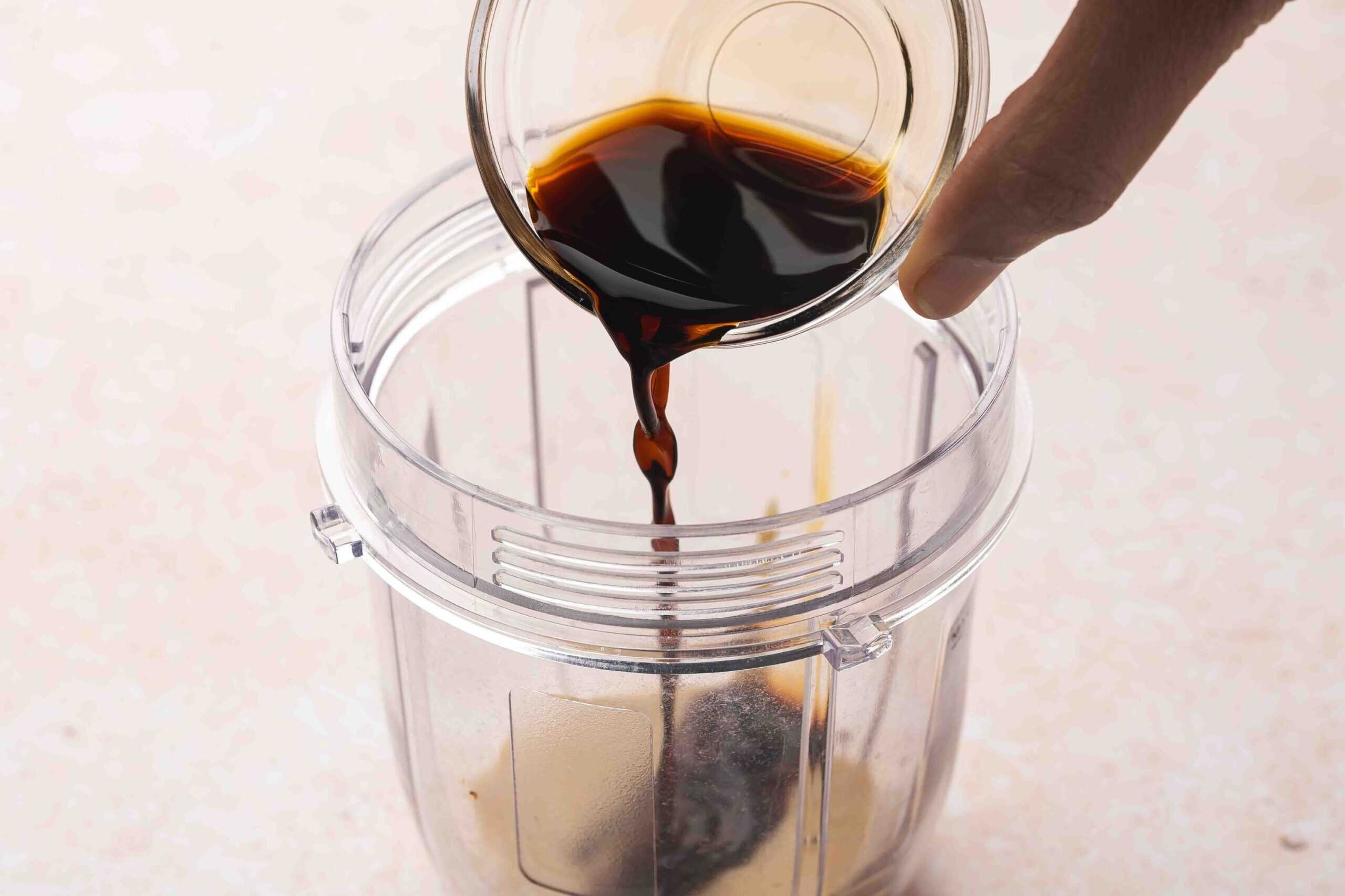 Tahini, sesame oil, soy sauce, maple syrup, rice vinegar, ginger, and red pepper flakes in a blender jar