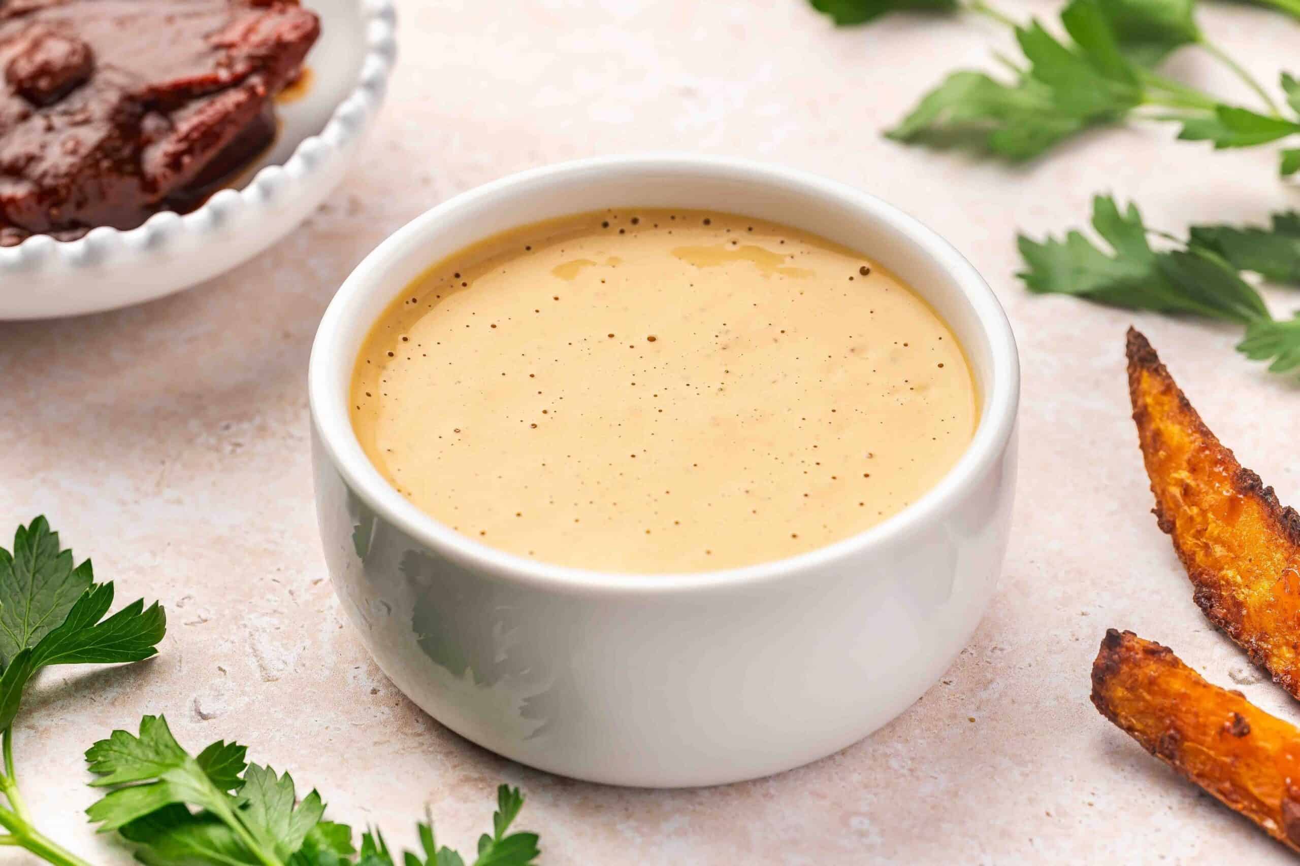 Creamy homemade chipotle sauce in a small white bowl with a smooth texture