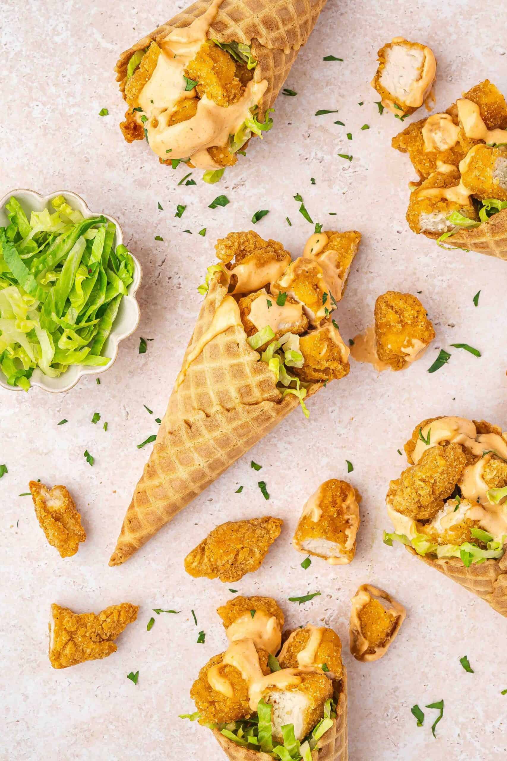 Party snack idea using chicken nuggets and waffle cones with lettuce