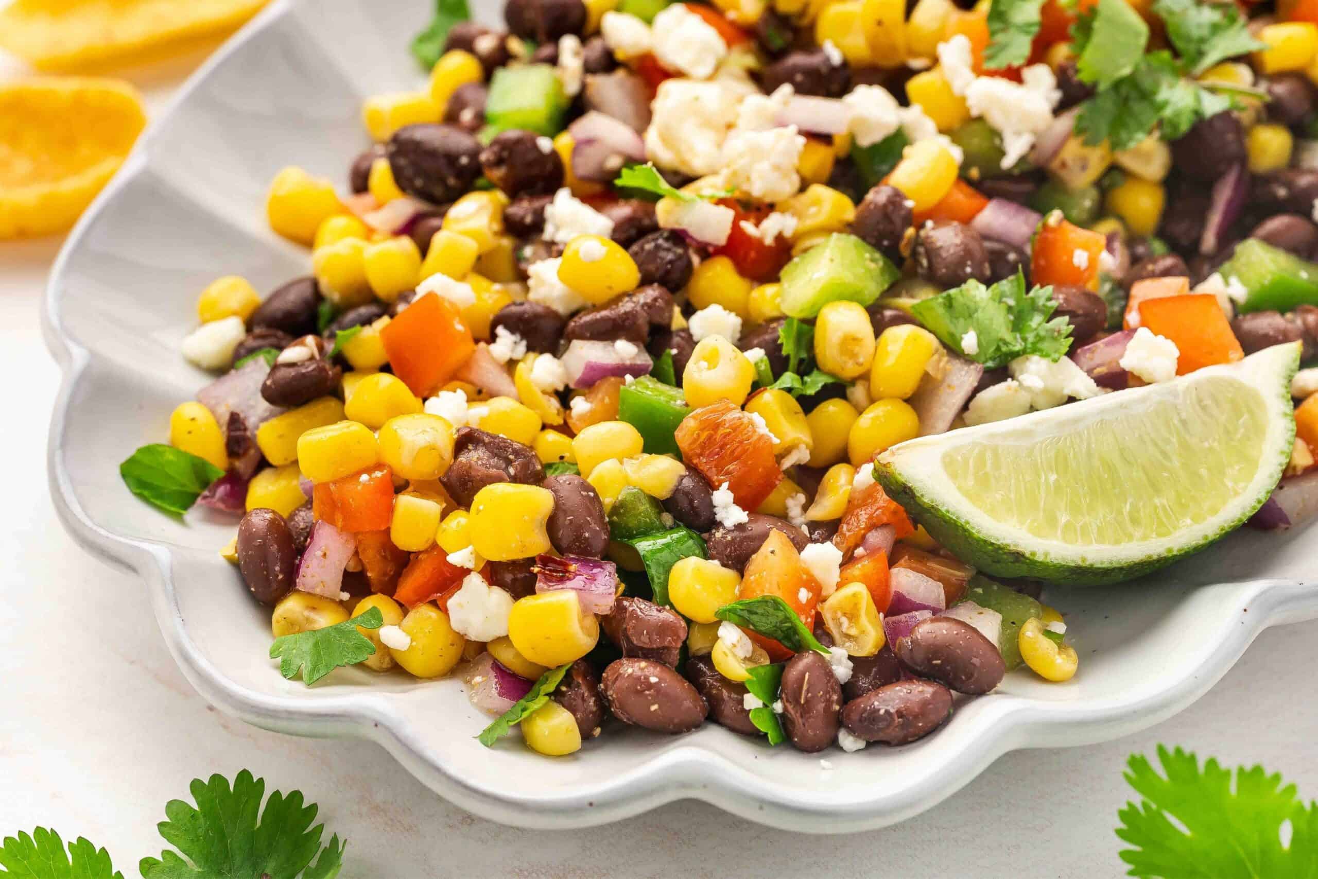 Close macro of black bean, corn, and red onion in dip