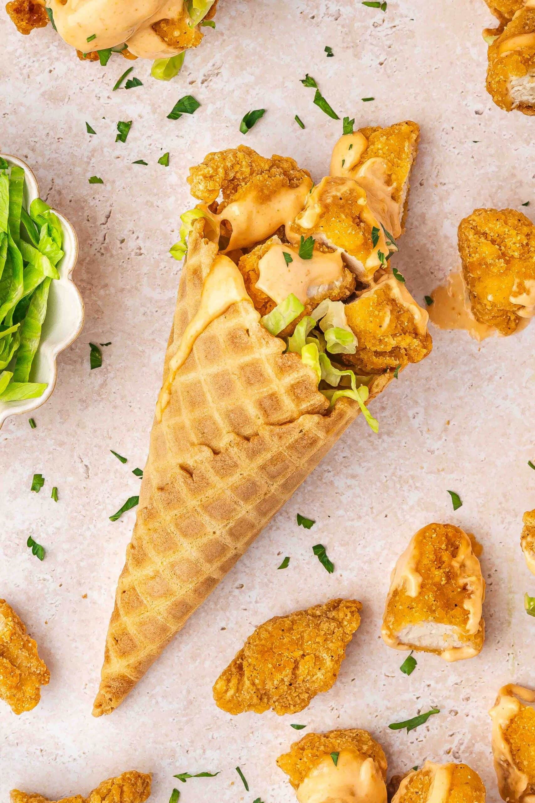 Chicken in waffle cones with lettuce and spicy sauce for entertaining