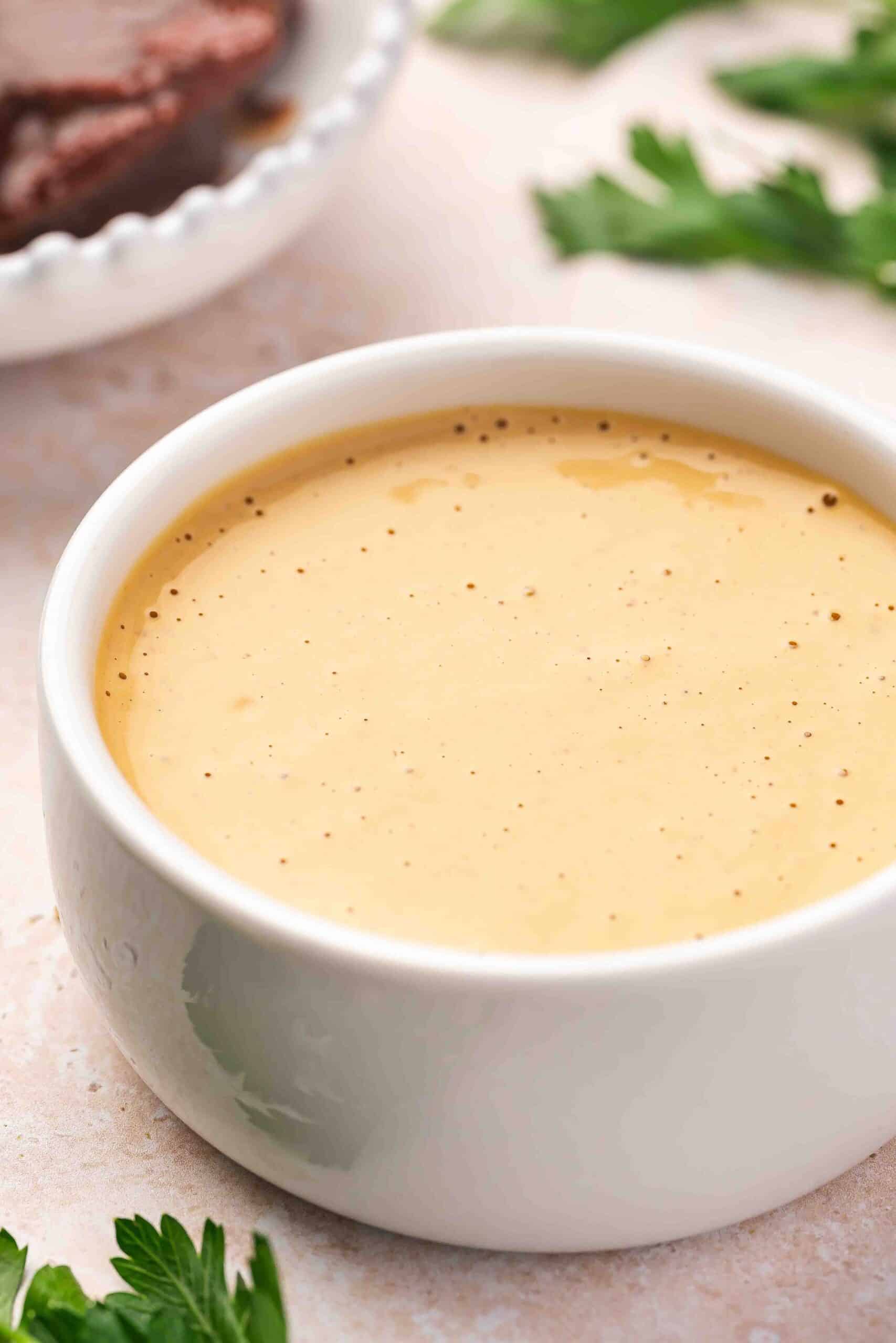 Extreme close-up of creamy homemade chipotle sauce showing smooth, rich texture