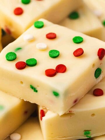 Easy 3-ingredient sugar cookie fudge made with white chocolate and topped with festive Christmas sprinkles