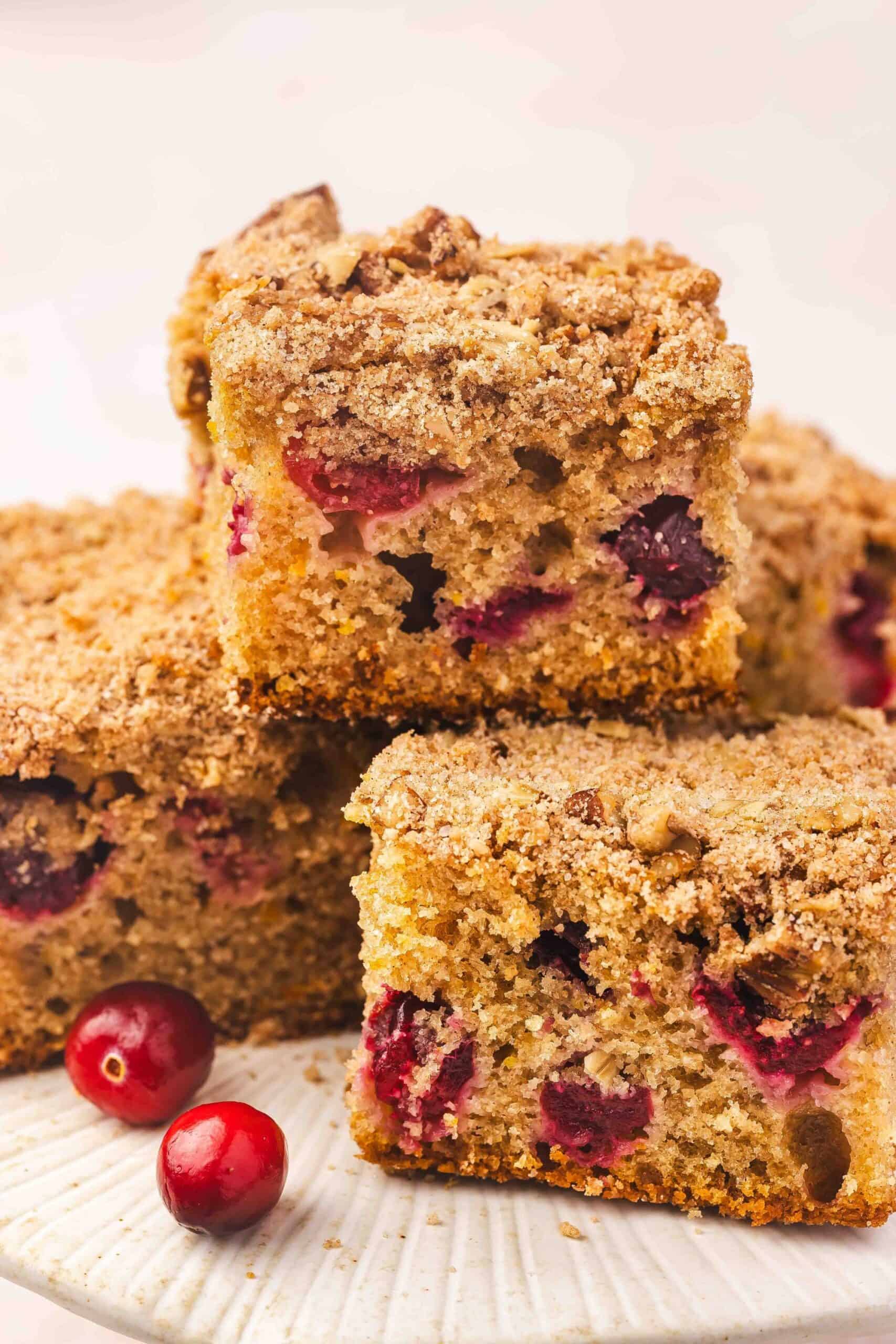 Warm cranberry orange coffee cake topped with streusel served with hot coffee