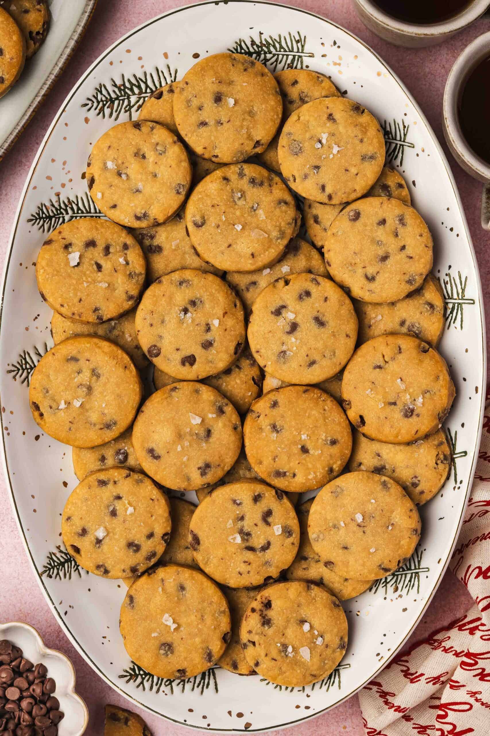 Golden espresso chocolate chip shortbread cookies arranged on a baking sheet, edges just perfectly crisp