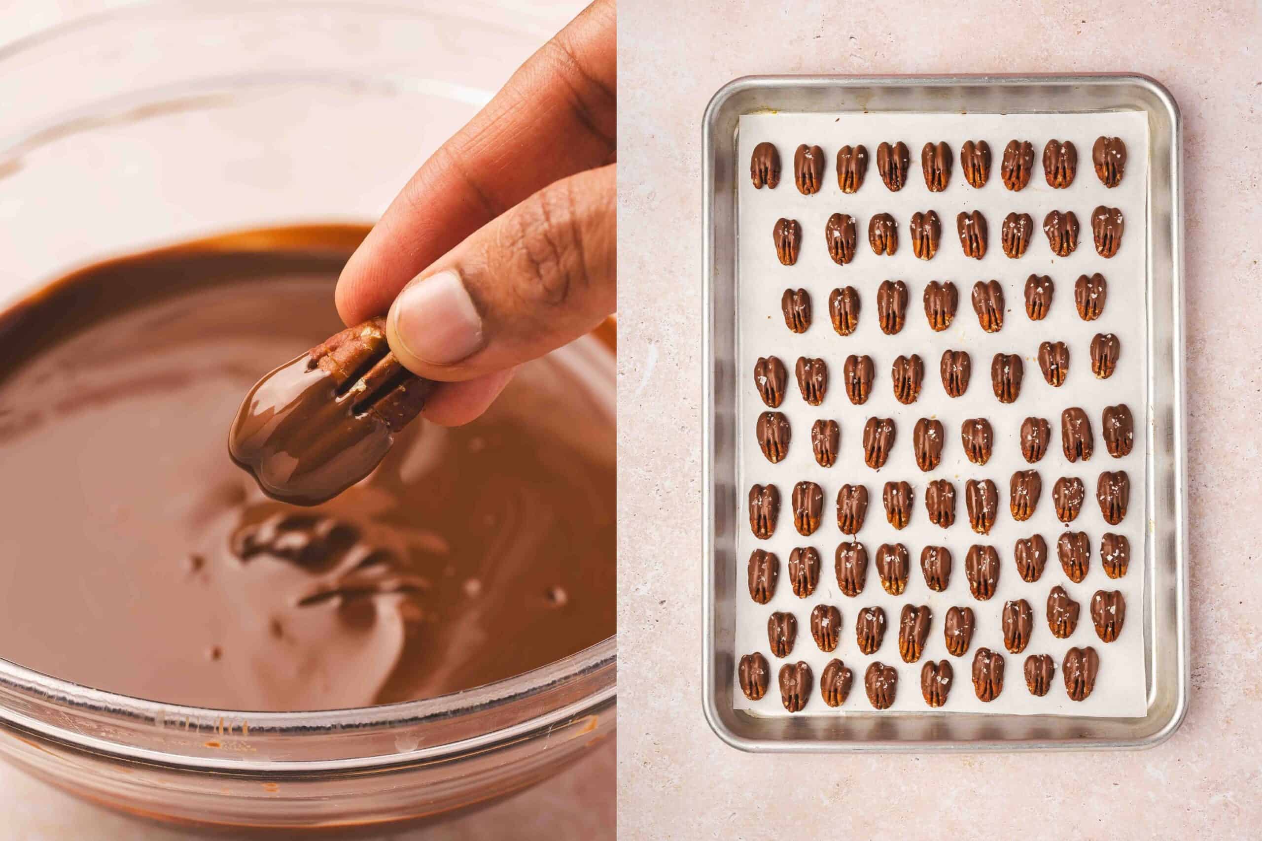 Half-dipped pecans on parchment paper being sprinkled with flaky sea salt, chocolate setting to firm.